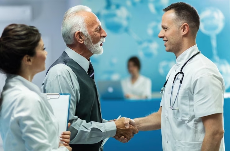 Professional handshake between businessman and doctor for authorization management